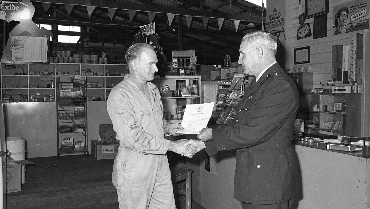 Mr Stan Moulds receives his Police certificate and cheque from Inspector Escott, 1972. Photos from Port Macquarie Museum archives.