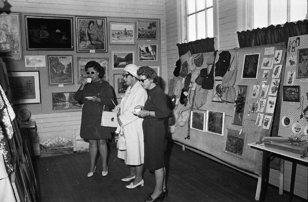 Talent artists: Guests viewing the art exhibition at Hamilton House, 1971.