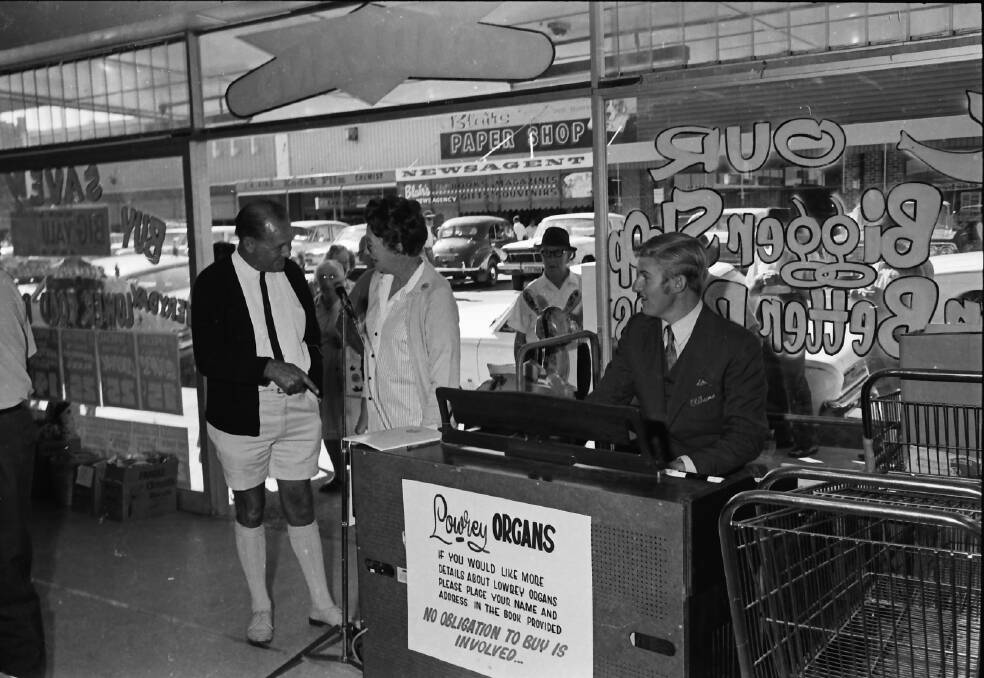 Great excitement: An Oldhams representative plays the organ during Jones' refurbished store opening, 1971. Photos: supplied by Port Macquarie Museum.