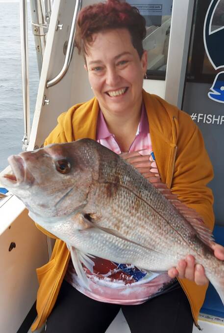 Visitor's luck: Despite the cold water off our coastline, Lizette from Orange recently caught this solid snapper on a trip with Fish Port Macquarie Charters. Photo: supplied