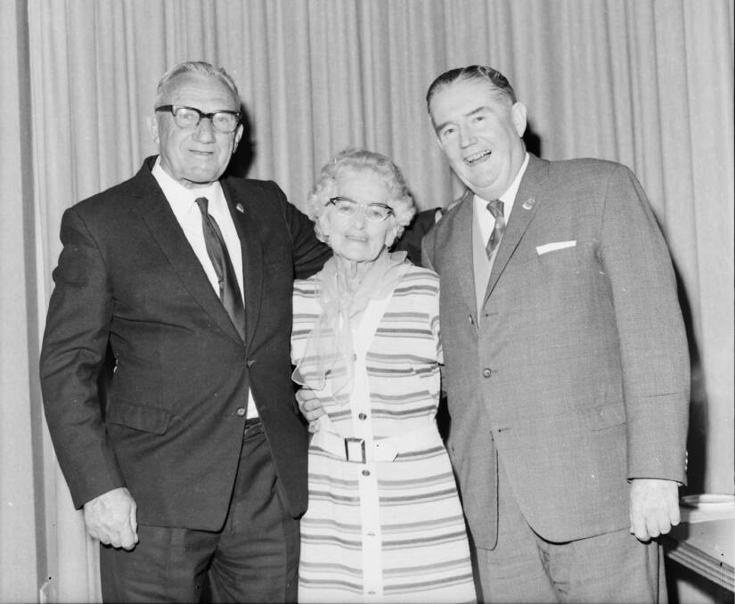 Honoured: Les Crisp, wife Tory, and Mr. R.S. Maher at the RSL function in honour of Mr Crisp. Photo: Supplied by Port Macquarie Museum.