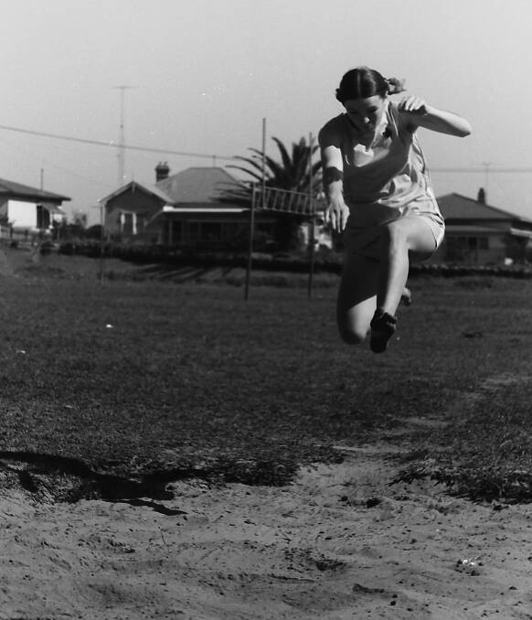 Sue Brooker leaps to win the senior girls broad jump, 1969
