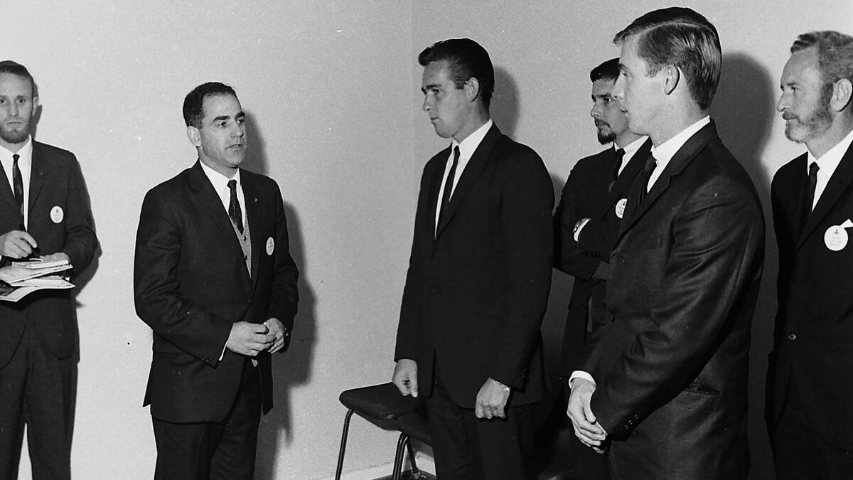Apex district governor Rex Solomon inducts two new members Bernie Quain and Roger Johnson into the Port Macquarie club, 1968.
