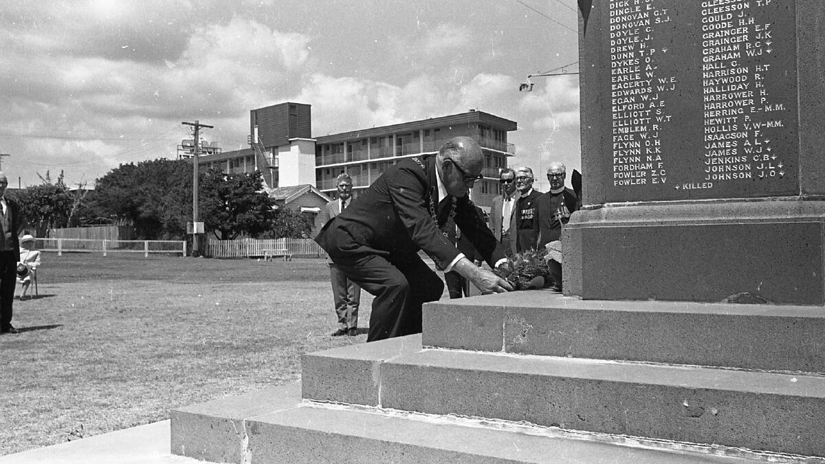 Lest We Forget: Port Macquarie mayor C.C. Adams places a wreath at the War Memorial during the Armistice Day service, 1971.