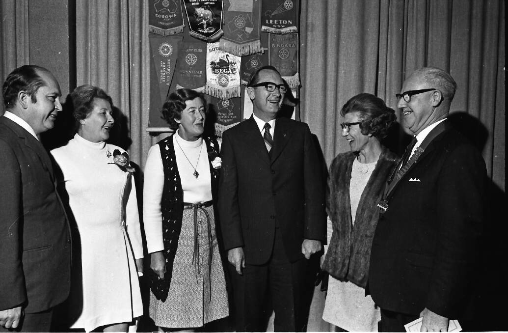 Happy exchanges: At the Rotary changeover dinner, from left, Harry and Mrs Butler, Mrs and Mr Len Carragher, and Mrs Allan and the Reverend Allan, 1971.