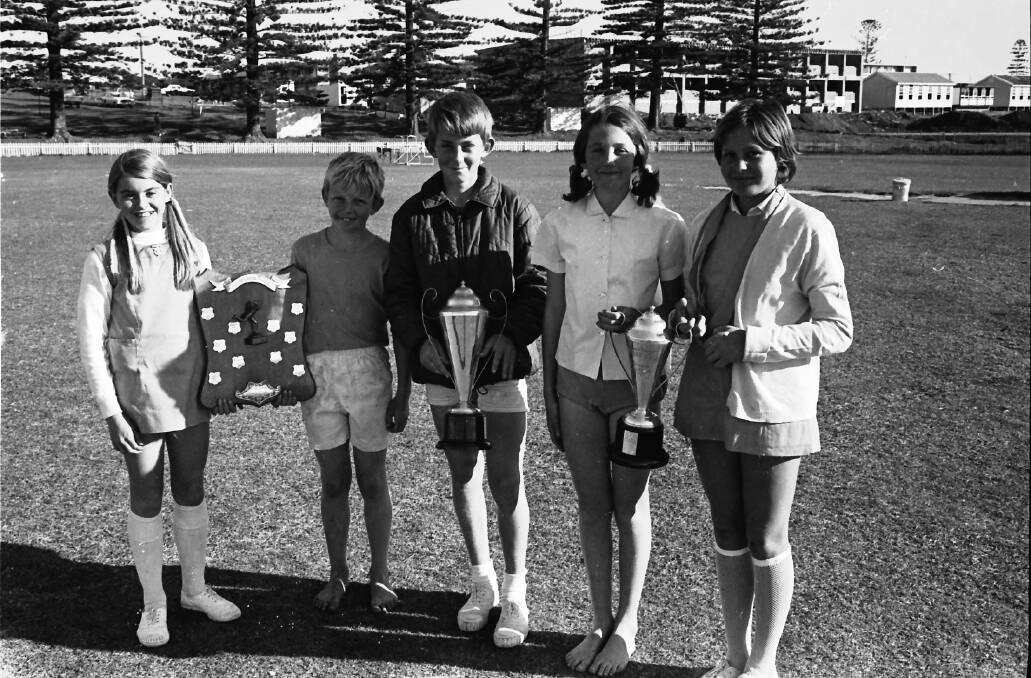 Primary School sports winners: From left Jackie Curren and Peter Collins (Hastings House Captains) hold the McLaren Shield, champion boy Tony Fowler, Lee Munday champion girl and runner up champion girl Roslyn Brest, 1971