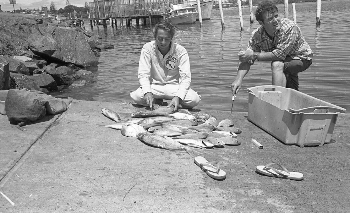 Bill Cook and his fellow fisherman about to clean their catch, 1972.