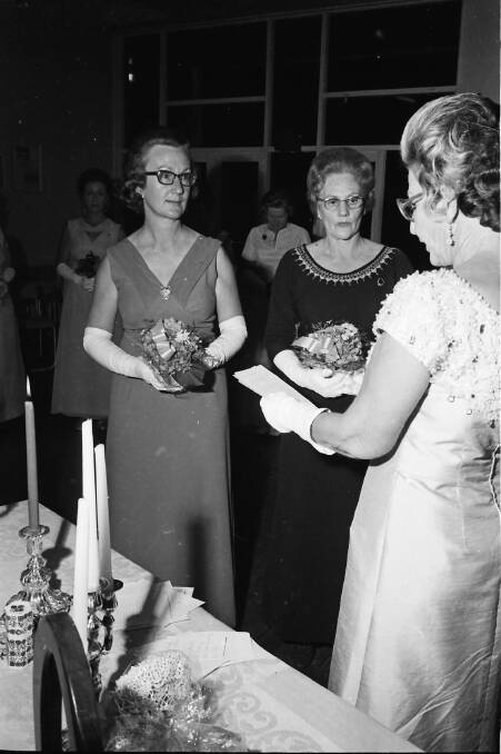 Congratulations: Quota vice presidents Jean Westerweller and Rene Gittoes, being installed by district governor, Edna West at the Quota Installation Dinner, 1971.