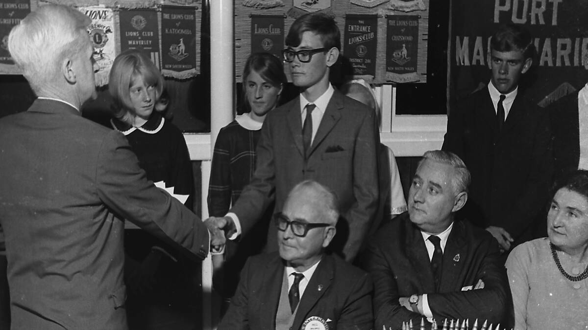Deserved win: Michael Stewart, winner of Port Macquarie Lions Club Youth of the Year, is congratulated by Mr Phil Parsons, August 1967.