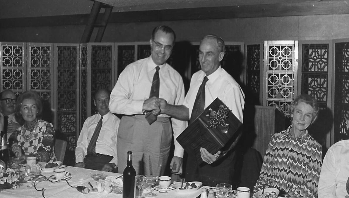 Chief Secretary Mr Willis (left) congratulates Bruce Jamieson on his retirement from the Fish Marketing Authority, 1972.
