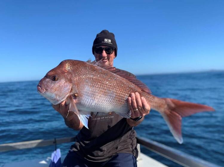 Quite a catch: Richard is all smiles after snatching this 5.5 kilogram snapper while fishing offshore with Ocean Star Charters. Photo: supplied.