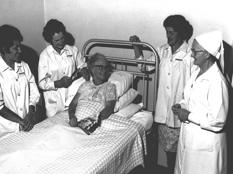 Helping hands: Mrs Barker attends to Mrs Leahy while Pink Ladies secretary, Mrs Gown, chats with Matron Bailey, 1970.