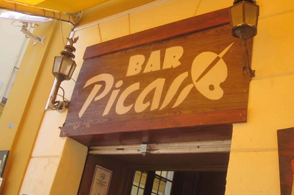 Cheers: In Malaga, Spain, citizens revere Picasso and the drink that inspired him. Bars such as this are also a tourist drawcard.