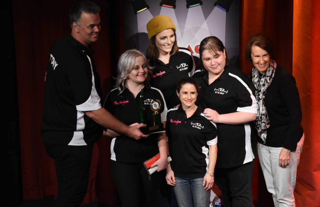 Well done: Port Macquarie MP Leslie Williams presents the Best Production award to Ipswich Little Theatre for their production The Asylum, at the Players Theatre On Act Play Festival June 9-11.