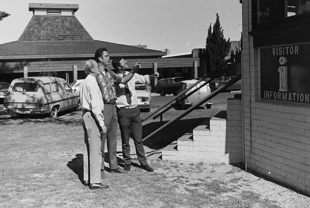Interested?: John Edmunds, Ross Machin and Greg Hannant viewing the Port Macquarie Visitor Information Centre on the Town Green, 1971.