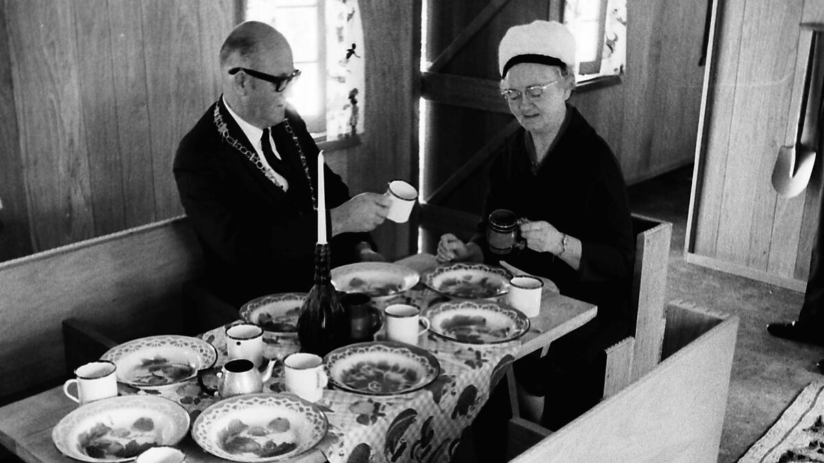 Anyone for tea?: Ald Adams and Matron Bailey sit at the Seven Dwarfs' dining table in Snow White’s Cottage, at Fantasy Glades, 1968.