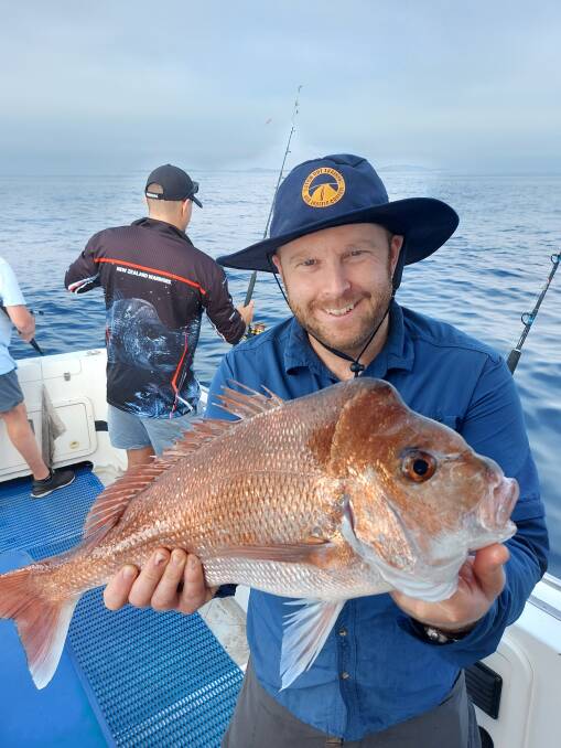 Big red: Back when the seas were kinder, Jacob from Port Macquarie scored this nice snapper during a trip out with Fish Port Macquarie Charters. Photo: supplied