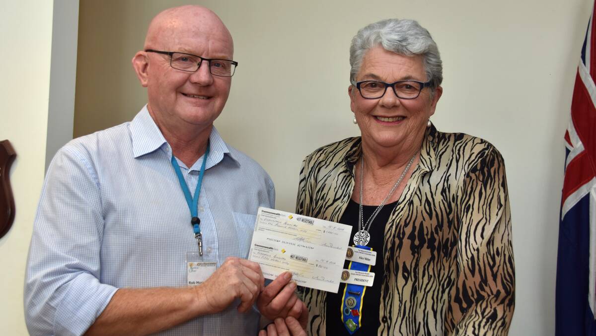 Cheque: Rob Moorehead receives a donation from CWA president Alice Miller.