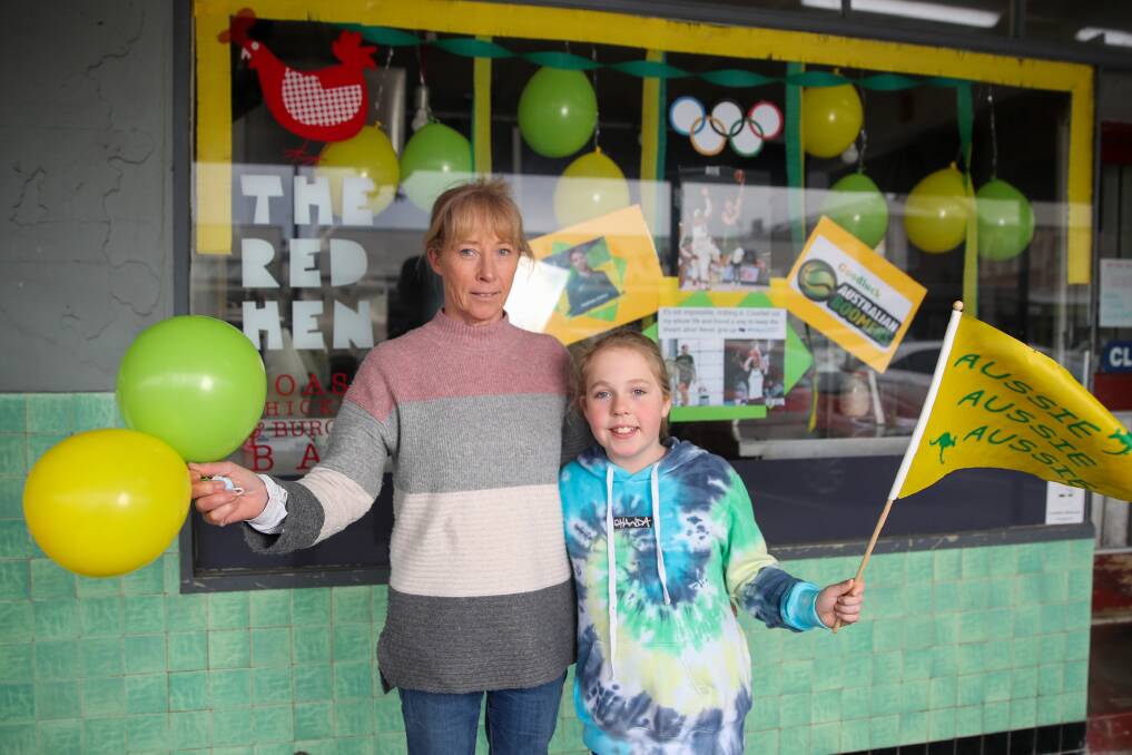 GO BOOMERS: Nathan Sobey's aunty Suellen Sproles alongside her daughter Hayley Astbury, 10, at Red Hen Port Fairy which is decked in green and gold. Picture: Morgan Hancock