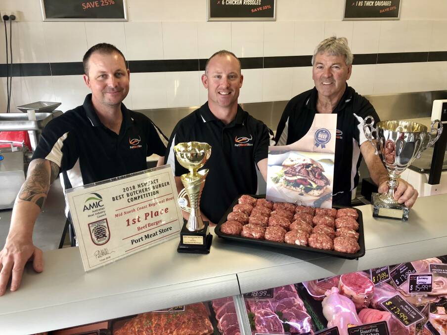 GOOD JOB: Ricky Baird and Daniel Johnston and Port City Meat Store owner Larry Dickson. Photo: Matt Attard.