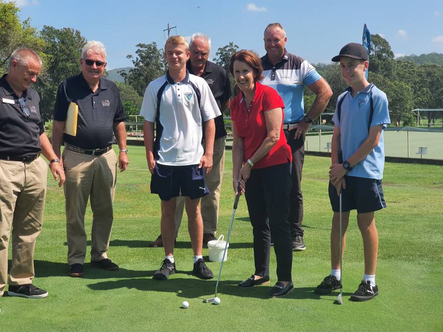 FUN: Port Macquarie MP Leslie Williams getting some tips from junior golfers Colby Wilkinson and Flether Murray. PHOTO: Laura Telford.