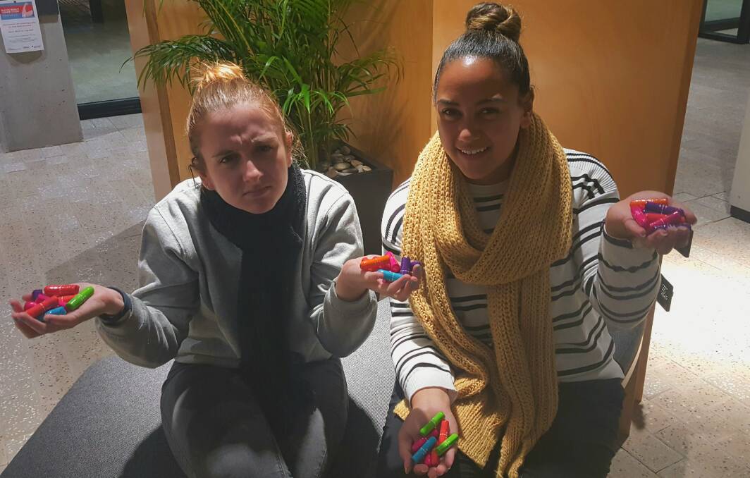 Not happy: Montanah Terry and Ashley Hendry said it is ridiculous that tampons and other sanitary items incur the GST. Photo: Laura Telford.