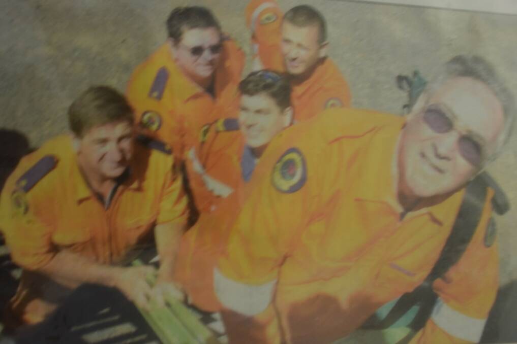 PRIME FORM: Ken Smith with his fellow SES crew out on the job. PHOTO: Port News.