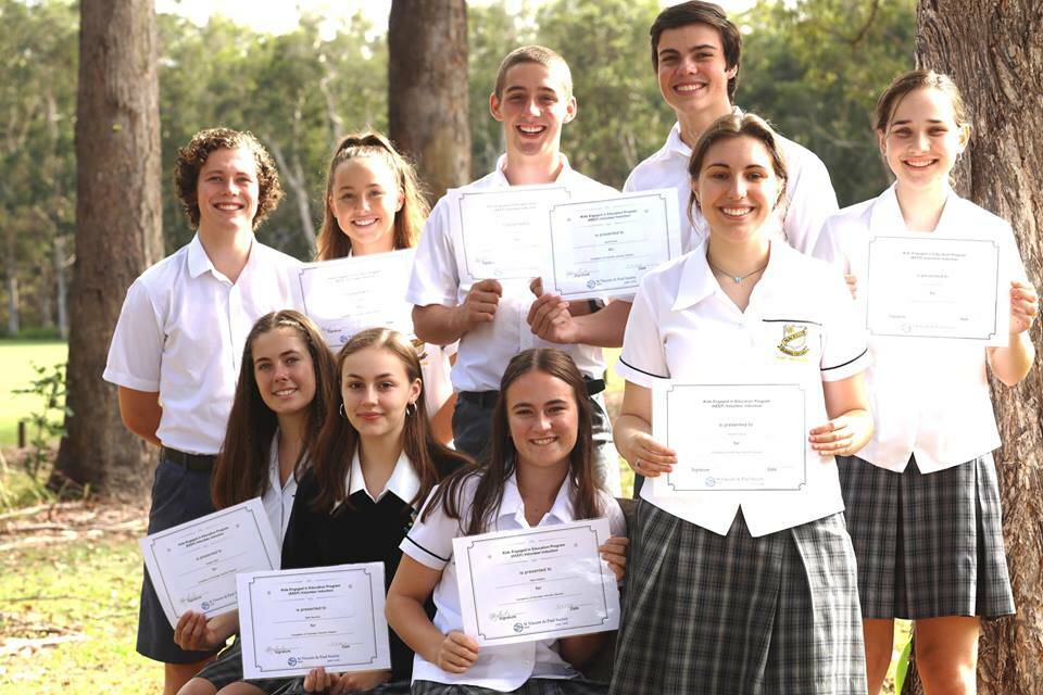 HELPING HAND: Students at MacKillop College help run an after school homework program at McCosker House.
