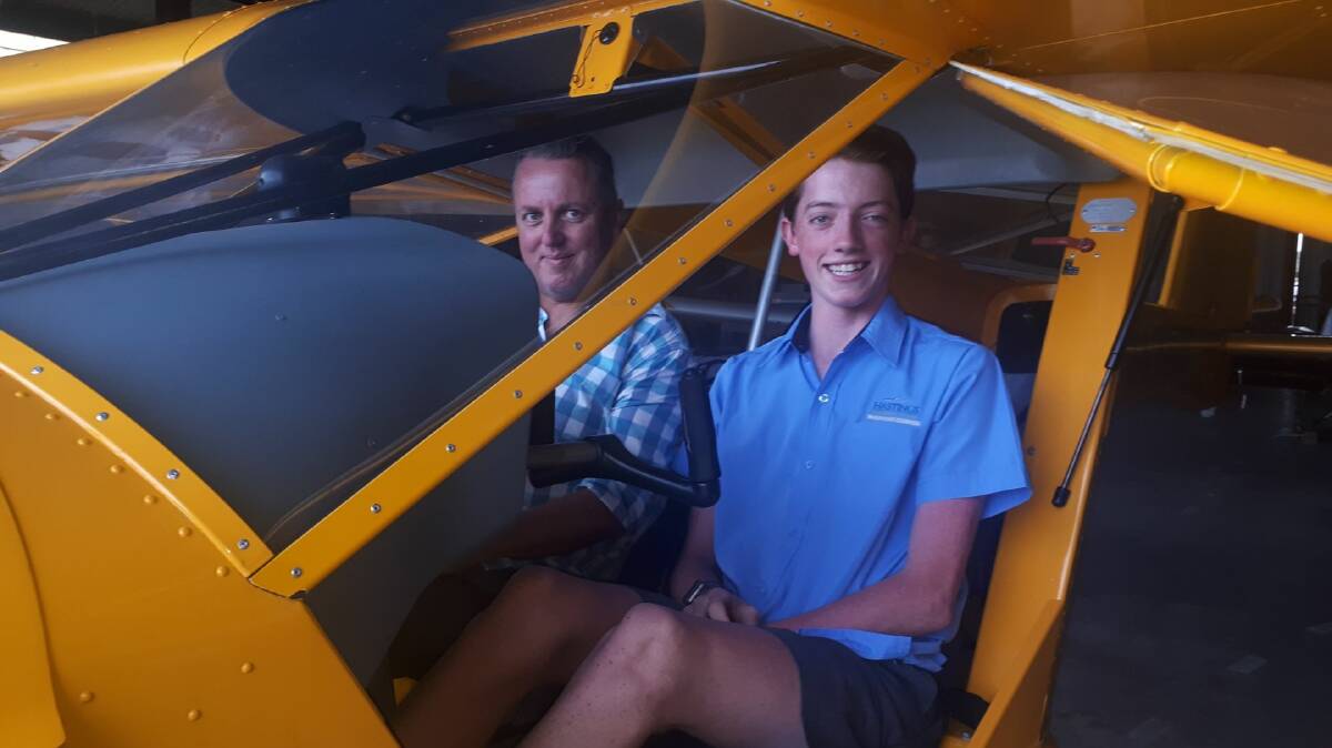 IN THE HOT SEAT: Billy with his instructor and mentor Mike Bullock at the airfield. 