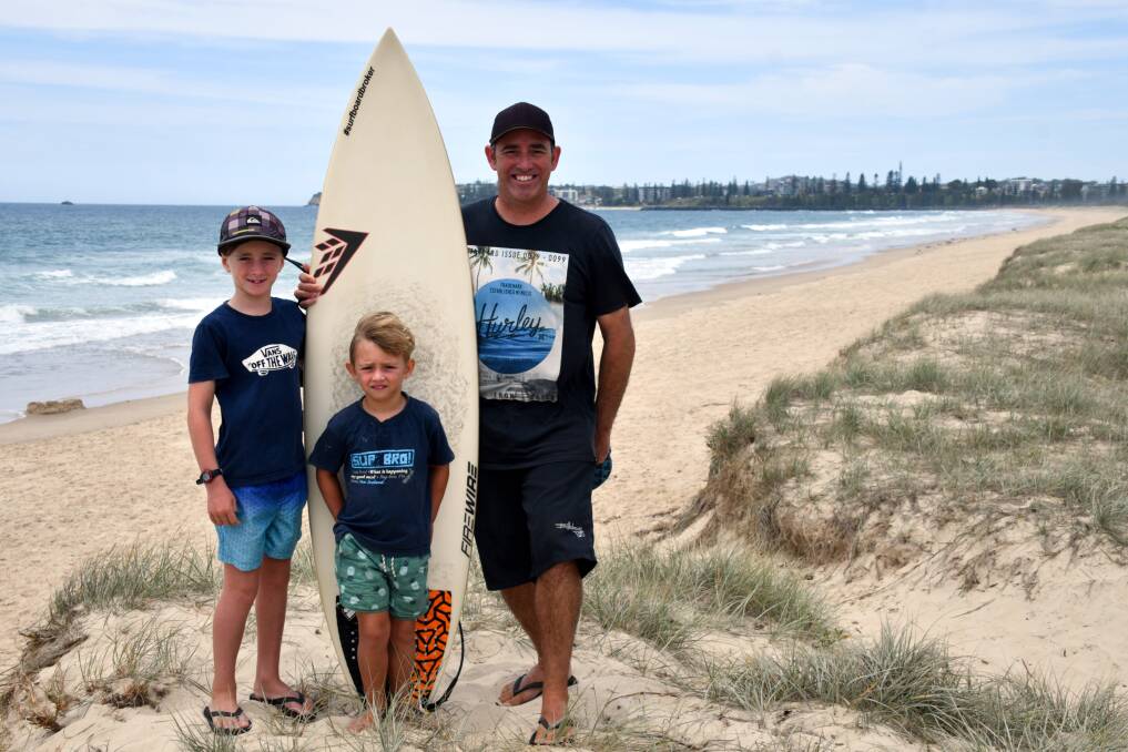 FUN IN THE SURF: Marlan, Tasman and Brad Wardrop at the beach where the penguin  was in the surf. Photo: Ivan Sajko.