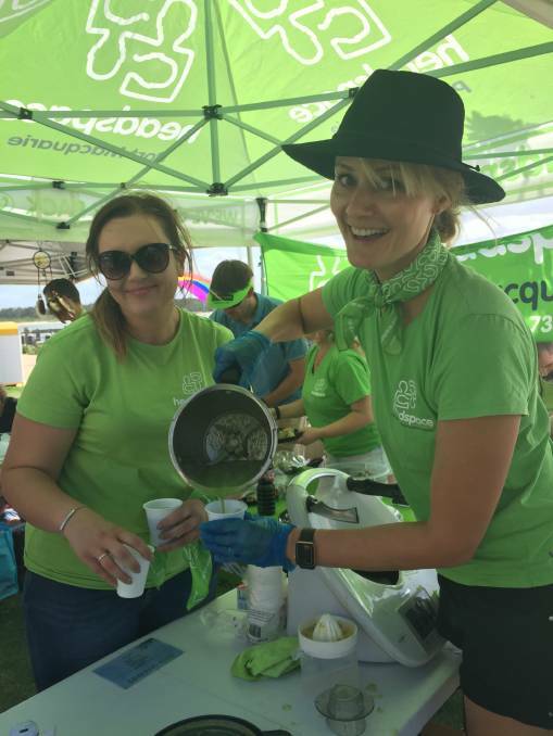 GREEN: Jules Jamieson and Kirri Terese pouring green smoothies at their Green Space during Youth Week 2018. PHOTO: Laura Telford.
