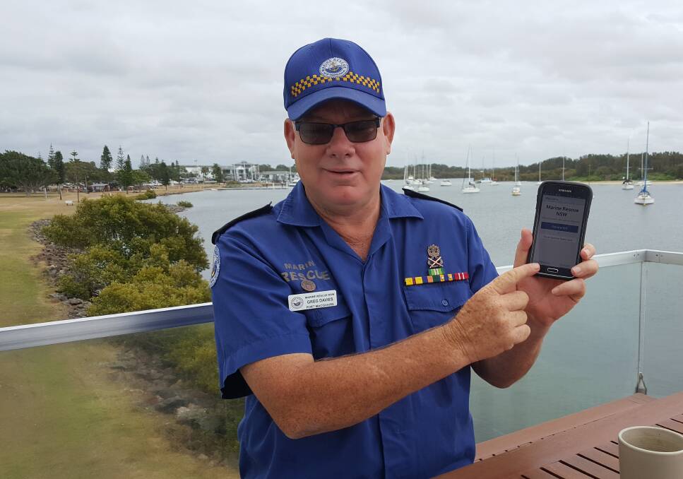 USE THE APP: Port Macquarie Marine Rescue unit commander Greg Davies with the Marine Rescue app. Photo: Laura Telford