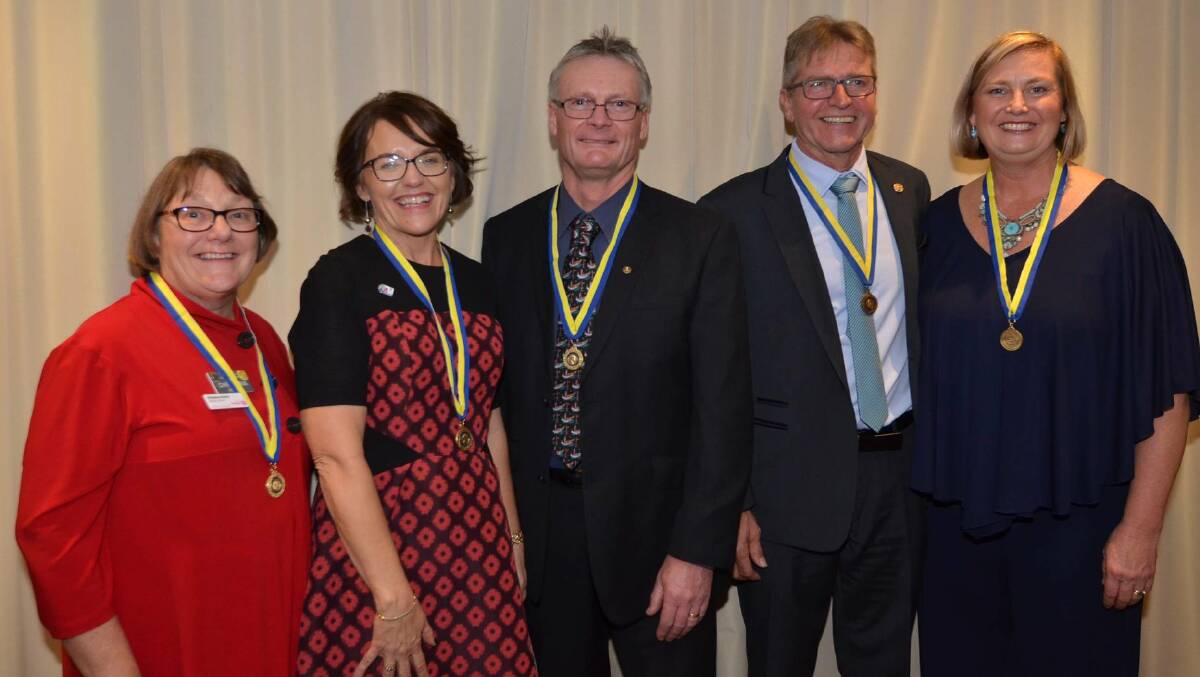 HONOURED: Christina Parkin, Jenny Sinclair, Peter Grob, Robert Brangwin and Sue Jogever on June 23 with their Paul Harris medalions. Photo: Rob Lloyd.