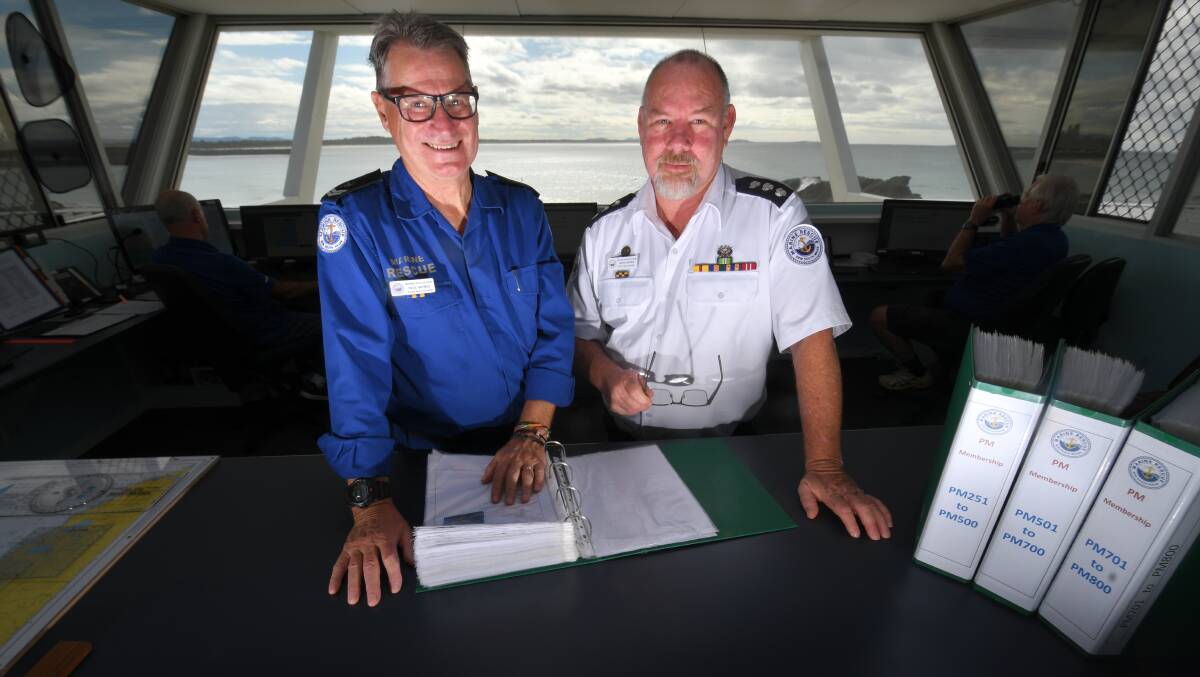 SAVING LIVES: Port Macquarie Marine Rescue's Paul Haynes and unit commander Greg Davies at the radio base at Town Beach. Photo: Ivan Sajko.