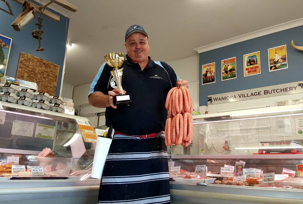 WINNER: Greg Bisaro with his prize winning sausages and the cup of victory. Photo: Laura Telford.
