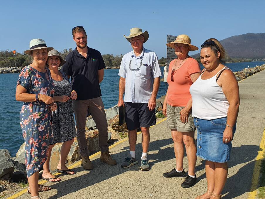 EXCITING: Penny Small, Mary Laing, Sam Mackie, Murray Rutledge, Marg Howard and Kirrily Slater at the North Haven breakwall. PHOTO: Laura Telford.