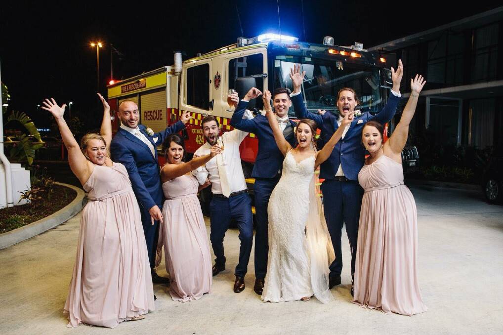 CELEBRATION: The Wedding party with the fire truck on Saturday night. Photo: Little Glimpses.