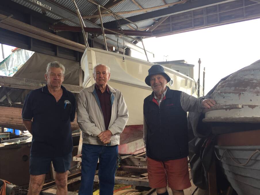 BRIGHT FUTURE: Ron Window, Bruce Oehlman and Michael Matthews in the slipway shed. Photo: Laura Telford.