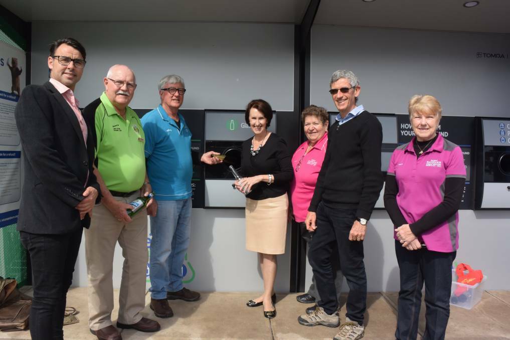 HELPING HAND: Port Macquarie MP Leslie Williams (centre) with Return and Earn local donation partner representatives Cody Boylan, John Hayes, Michael Jacobs, Leonie Heath, Malcolm McNeil and Leonie McWhirter.