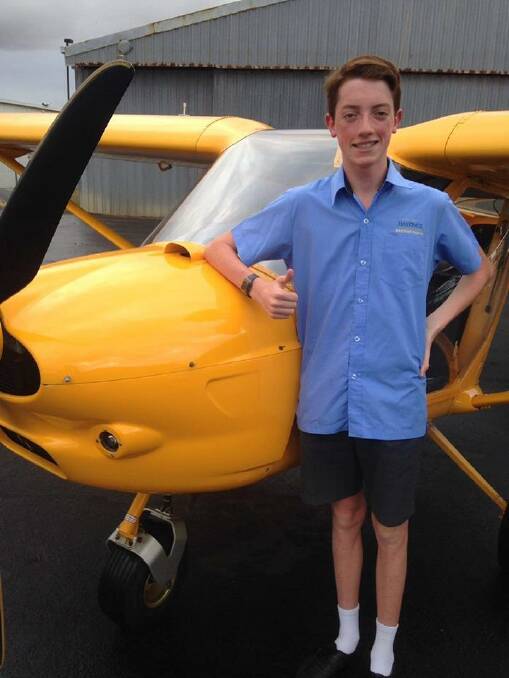 THUMBS UP:  William "Billy" Crowley with his plane at the Port Macquarie airport.