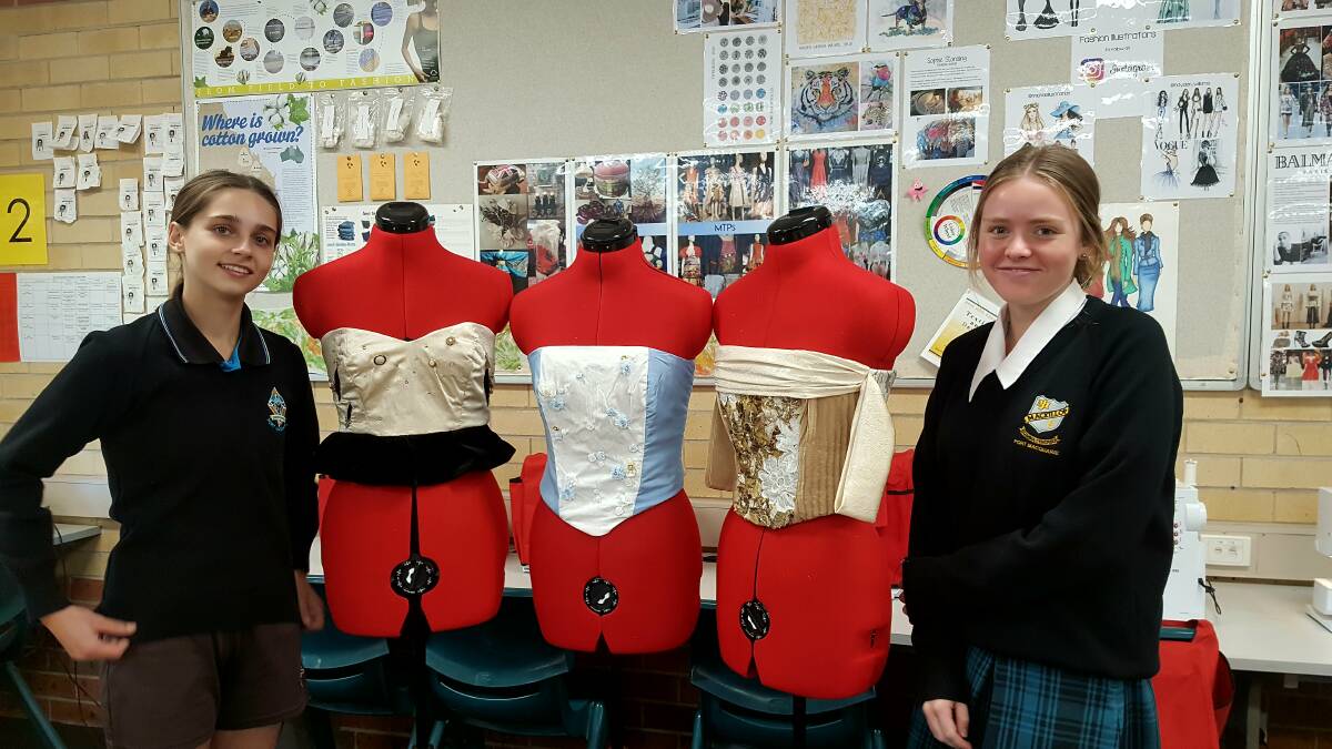 CREATIVE: Maddi McKee and Jess Hamel with some of the corsets student have made.
