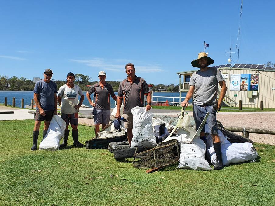 CLEAN: Andy Myers from OceanWatch Australia with the boys from Armstrong Oysters with the rubbish they collected. PHOTO: Laura Telford.
