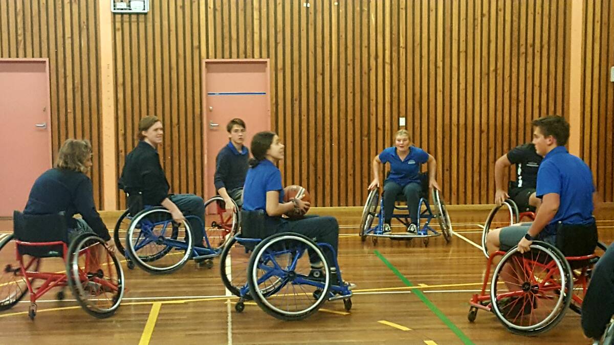 FUN: Students played wheelchair basketball after learning about the struggles of life in a chair. PHOTO: Laura Telford.