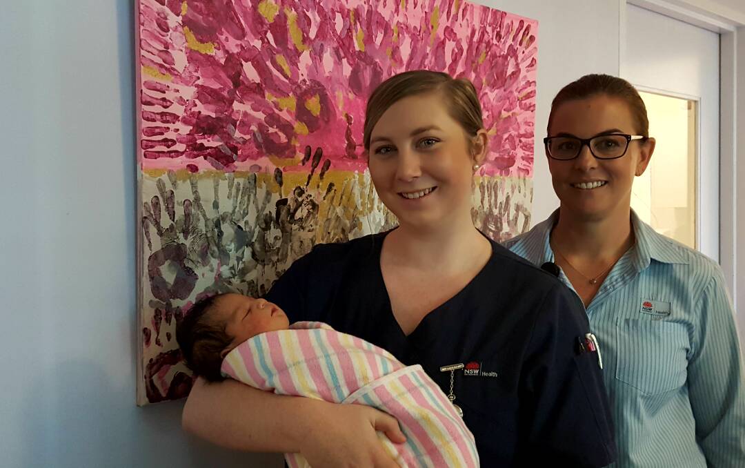 MIDWIFE: Baby Thakrani with student midwife Jordynn Kiem and acting maternity unit manager Olivia Tierney. Photo: Laura Telford.