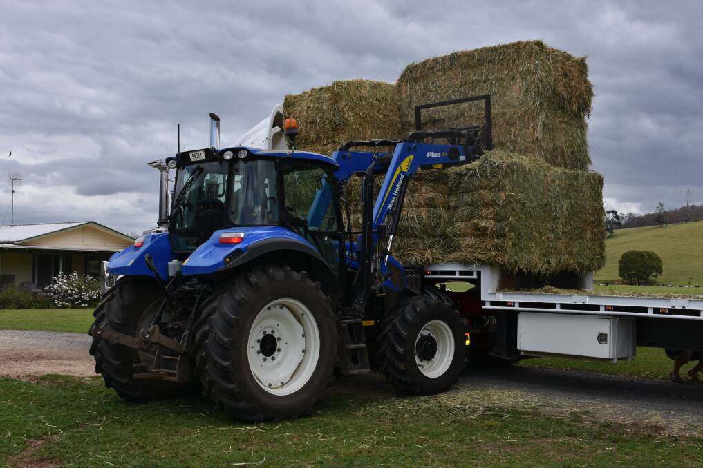 LIFELINE: Vital hay being unloaded and ready to be distributed. PHOTO: Laura Telford.