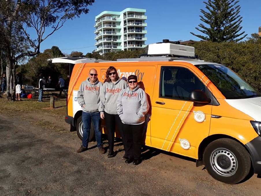 FOOTPATH LIBRARY: Orange Sky Laundry volunteers Malcolm and Tracy with vehicle manager Carly Bullard (middle) on the first day of the trial in Port Macquarie. 