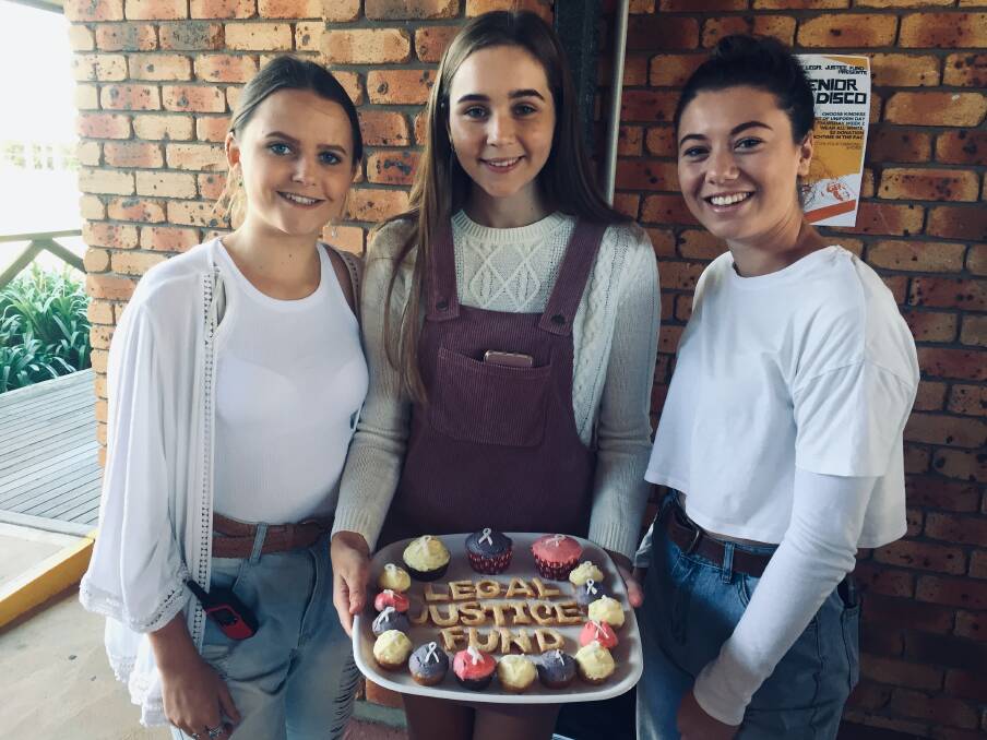 KINDNESS: Grace Biron, Kirrah Stewart and Georgia Marino with some of the delicious delights at the bake sale. PHOTO: Laura Telford.