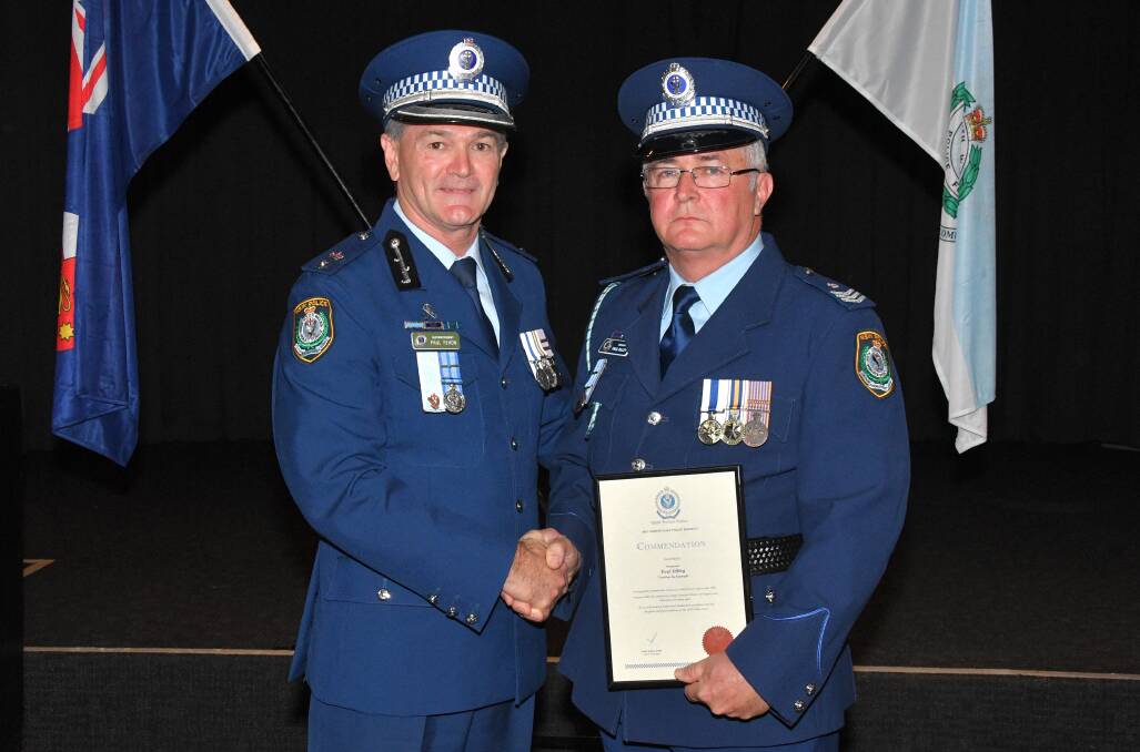 ASSIST: Assistant Commissioner Northern Regions Max Mitchell and Sgt Paul Dilley with his commendation.