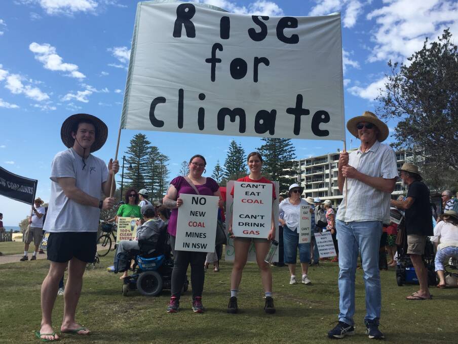 CLIMATE WALK: Sean Page, Amy Targett, Kylie Neilson and Jeff Browne lead the walk from Town Beach to Town Green. Photo: Laura Telford.