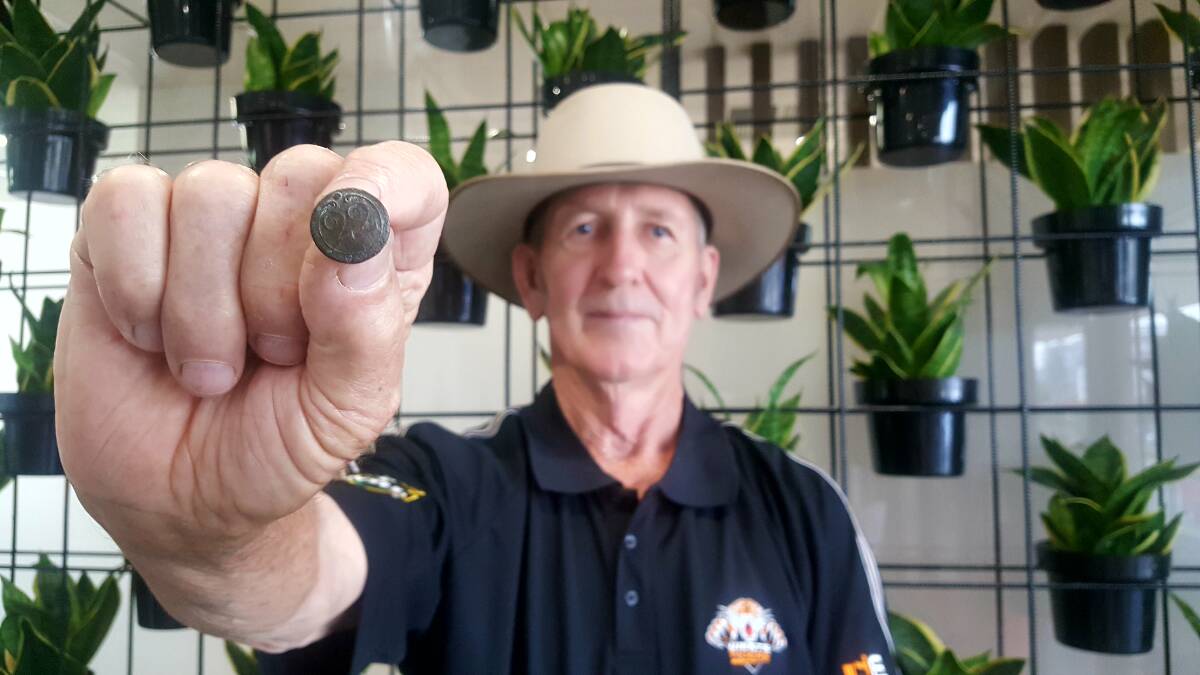 FOUND: Lloyd Hewens believes he has found a button from 1824. PHOTO: Laura Telford.